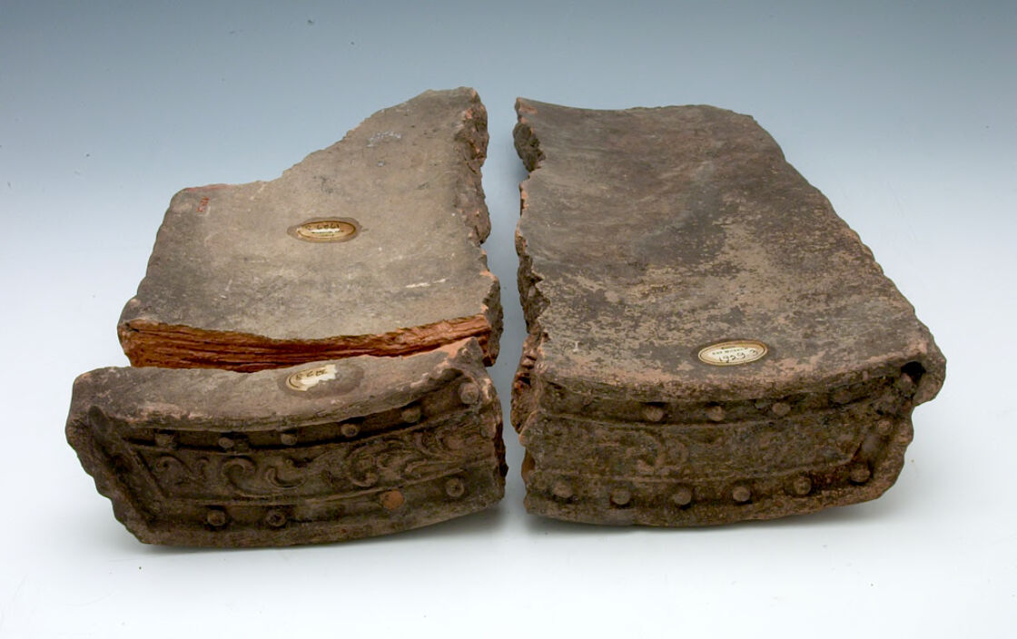 Three Fragments of an Arciform Pendent Eaves-End Roof Tile with Scrolling...