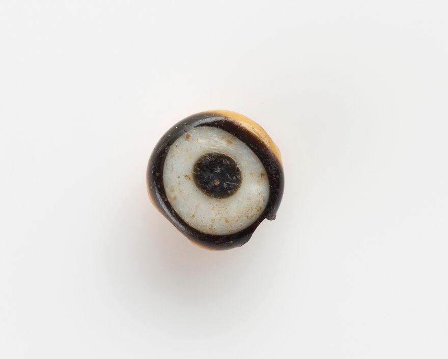 Eye-bead, with a lateral bore; the eyelet broken off