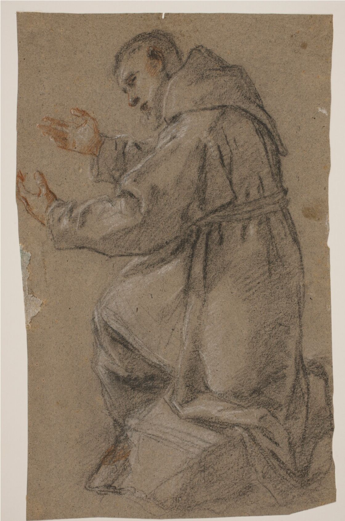 Kneeling friar with outstretched hands